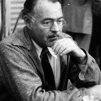 Hemingway with glasses in mid-life
