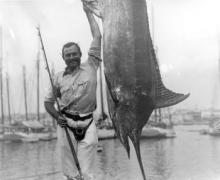 Ernest Hemingway posing with a marlin, Cuba, 1934